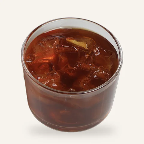 Cold brew over ice in a glass